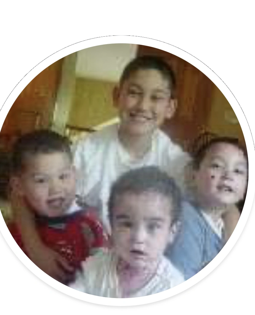 An earlier childhood photo of Julian with his brothers Nate and Jake